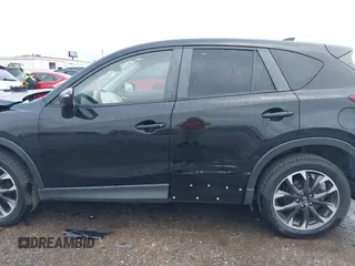 2016 Mazda CX-5 Grand Touring z VIN JM3KE4DY9G0605489, wystawiony jako IAAI lot #42085160 z przebiegiem 160 338 mil mil oraz . Historia ofert i sprzedaży dostępna na DreamBid. Obrazek 14.