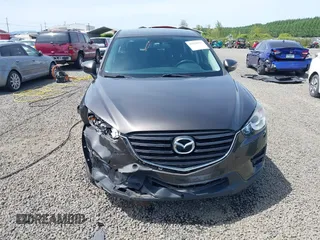 2016 Mazda CX-5 Sport with VIN JM3KE4BY8G0785812, listed as a IAAI auction lot 42324083 with 57,405 mi miles and . Bid and sale history available at DreamBid. Image 12.