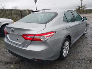 2020 Toyota Camry LE with VIN 4T1C11AK5LU869525, listed as a IAAI auction lot 41693706 with 134,201 mi miles. Bid and sale history available at carsss.com. Image 4.