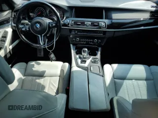 2016 BMW M5 z VIN WBSFV9C55GD595799, wystawiony jako Copart lot #65708864 z przebiegiem 104 198 mil mil oraz Szkoda całkowita • Salvage title. Historia ofert i sprzedaży dostępna na DreamBid. Obrazek 8.