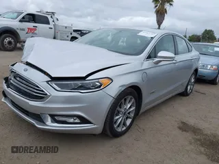 2017 Ford Fusion Energi SE with VIN 3FA6P0PU9HR354096, listed as a IAAI auction lot 42064703 with 69,601 mi miles. Bid and sale history available at carsss.com. Image 2.