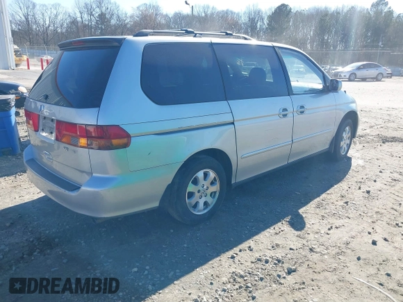 2004 Honda Odyssey EX-L with VIN 5FNRL18974B057715, listed as a IAAI auction lot 41762518 with 193,626 mi miles and . Bid and sale history available at DreamBid. Image 4.