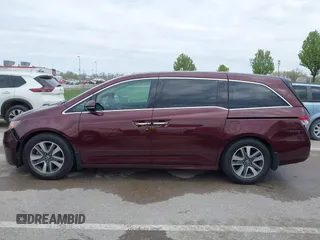 2014 Honda Odyssey Touring with VIN 5FNRL5H9XEB073156, listed as a IAAI auction lot 41990714 with 166,129 mi miles and . Bid and sale history available at DreamBid. Image 14.