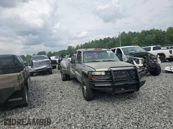 2001 Chevrolet Silverado 3500 LS z VIN 1GCJC33121F182199, wystawiony jako Copart lot #72530404 z przebiegiem 252 199 mil mil oraz Szkoda całkowita • Salvage title. Historia ofert i sprzedaży dostępna na DreamBid. Obrazek 12.
