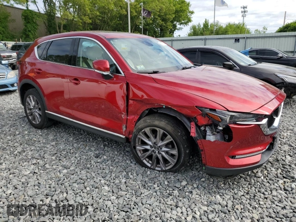 2019 Mazda CX-5 Grand Touring with VIN JM3KFBDM1K0559891, listed as a Copart auction lot 58775275 with 45,126 mi miles and Salvage title. Bid and sale history available at DreamBid. Image 4.