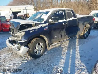 2010 Toyota Tundra 4WD Truck with VIN 5TFUW5F11AX120069, listed as a IAAI auction lot 41378490 with 413,655 mi miles. Bid and sale history available at carsss.com. Image 2.