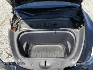 2022 Tesla Model Y Performance z VIN 7SAYGDEF0NF540933, wystawiony jako Copart lot #56087145 z przebiegiem 59 717 mil mil oraz Szkoda całkowita • Salvage title. Historia ofert i sprzedaży dostępna na DreamBid. Obrazek 11.