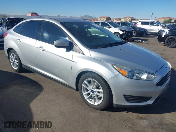 2018 Ford Focus SE z VIN 1FADP3F27JL204873, wystawiony jako IAAI lot #41657504 z przebiegiem 99 224 mil mil oraz . Historia ofert i sprzedaży dostępna na DreamBid. Obrazek 1.