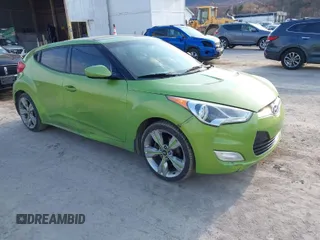 2012 Hyundai Veloster w/Gray Int z VIN KMHTC6AD1CU051895, wystawiony jako IAAI lot #41767714 z przebiegiem 210 928 mil mil oraz . Historia ofert i sprzedaży dostępna na DreamBid. Obrazek 1.