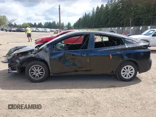 2021 Toyota Prius L Eco with VIN JTDKAMFU3M3140233, listed as a IAAI auction lot 42182685 with 38,842 mi miles and . Bid and sale history available at DreamBid. Image 6.