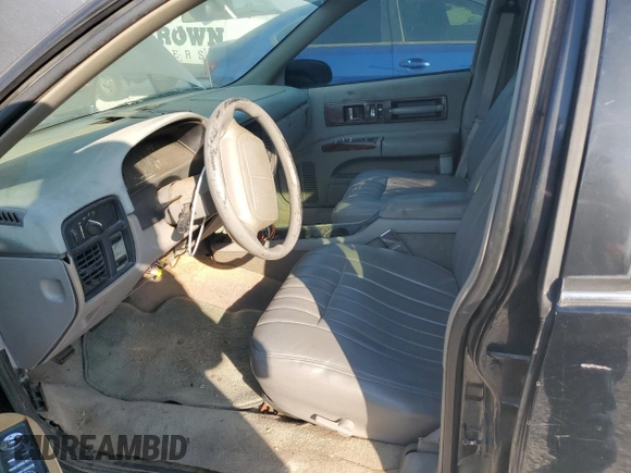 1996 Chevrolet Caprice with VIN 1G1BL82P2TR106404, listed as a Copart auction lot 74213214 with 156,588 mi miles and Salvage title. Bid and sale history available at DreamBid. Image 7.