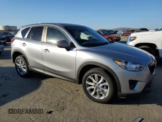 2014 Mazda CX-5 Grand Touring with VIN JM3KE2DY8E0412025, listed as a Copart auction lot 42863655 with 72,416 mi miles and Salvage Title. Bid and sale history available at carsss.com. Image 4.