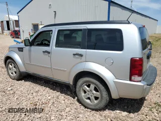 2008 Dodge Nitro SXT z VIN 1D8GU28K98W178732, wystawiony jako Copart lot #61411305 z przebiegiem 185 194 mil mil oraz Czysty tytuł • Clean title. Historia ofert i sprzedaży dostępna na DreamBid. Obrazek 2.