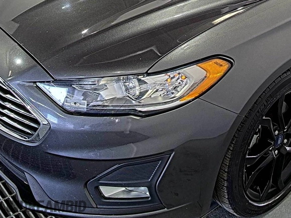 2020 Ford Fusion SE z VIN 3FA6P0HD6LR189762, wystawiony jako IAAI lot #42780149 z przebiegiem 51 099 mil mil oraz . Historia ofert i sprzedaży dostępna na DreamBid. Obrazek 18.