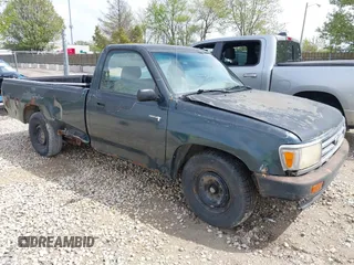 1993 Toyota T100 DX with VIN JT4VD10AXP0012790, listed as a IAAI auction lot 42179976 with 215,526 mi miles. Bid and sale history available at carsss.com. Image 1.