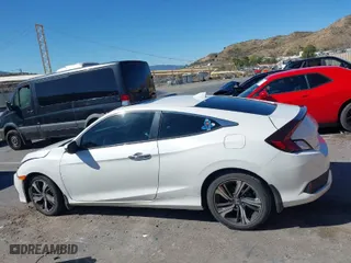 2017 Honda Civic Coupe Touring with VIN 2HGFC3B95HH356466, listed as a IAAI auction lot 41651157 with 100,940 mi miles. Bid and sale history available at carsss.com. Image 14.