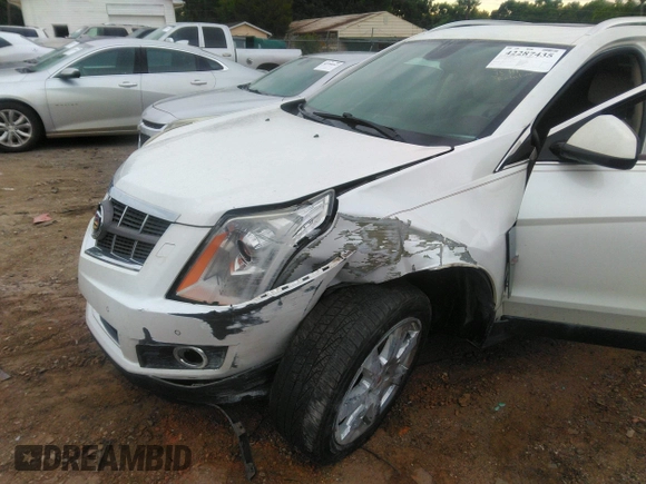 2012 Cadillac SRX Performance Collection z VIN 3GYFNBE32CS653172, wystawiony jako IAAI lot #42287435 z przebiegiem 161 065 mil mil oraz . Historia ofert i sprzedaży dostępna na DreamBid. Obrazek 6.