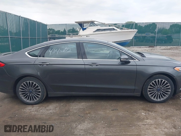 2017 Ford Fusion Titanium with VIN 3FA6P0K96HR208757, listed as a IAAI auction lot 42400172 with 90,000 mi miles and . Bid and sale history available at DreamBid. Image 13.
