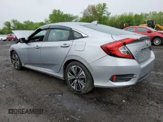2017 Honda Civic EX-L z VIN 19XFC1F74HE209787, wystawiony jako Copart lot #56352415 z przebiegiem 130 264 mil mil oraz Szkoda całkowita • Salvage title. Historia ofert i sprzedaży dostępna na DreamBid. Obrazek 2.