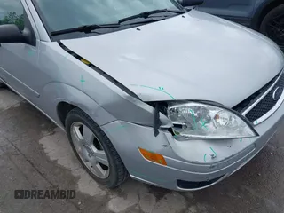 2007 Ford Focus S z VIN 1FAHP34NX7W358354, wystawiony jako IAAI lot #42242364 z przebiegiem 48 900 mil mil oraz . Historia ofert i sprzedaży dostępna na DreamBid. Obrazek 6.