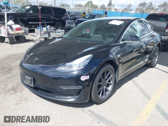 2019 Tesla Model 3 Mid Range with VIN 5YJ3E1EA3KF325056, listed as a IAAI auction lot 41771543 with 183,157 mi miles and . Bid and sale history available at carsss.com. Image 17.