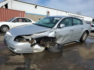 2010 Buick Lucerne CXL with VIN 1G4HC5E16AU103258, listed as a Copart auction lot 52495315 with 136,186 mi miles and Salvage Title. Bid and sale history available at DreamBid. Image 1.