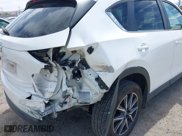 2018 Mazda CX-5 Touring with VIN JM3KFACM3J0381122, listed as a IAAI auction lot 42023838 with 76,121 mi miles. Bid and sale history available at carsss.com. Image 6.