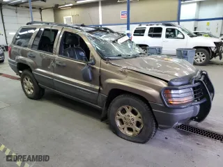 2001 Jeep Grand Cherokee Laredo with VIN 1J4GW48N01C529690, listed as a Copart auction lot 82037774 with 142,673 mi miles and Salvage Title. Bid and sale history available at carsss.com. Image 4.