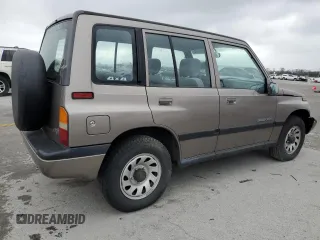 1997 Suzuki Sidekick JX z VIN 2S3TD03V4V6403519, wystawiony jako Copart lot #49666085 z przebiegiem 54 577 mil mil oraz Szkoda całkowita • Salvage title. Historia ofert i sprzedaży dostępna na DreamBid. Obrazek 3.