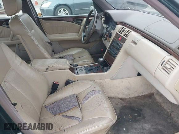 1997 Mercedes-Benz E-Class with VIN WDBJF55F3VJ034009, listed as a IAAI auction lot 41710225 with 239,673 mi miles. Bid and sale history available at carsss.com. Image 5.