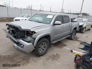 2018 Toyota Tacoma SR5 with VIN 3TMAZ5CN7JM053453, listed as a IAAI auction lot 41430111 with 128,149 mi miles. Bid and sale history available at carsss.com. Image 2.