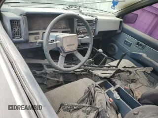 1988 Nissan Hardbody z VIN 1N6HD16S3JC326667, wystawiony jako Copart lot #84568594 z przebiegiem Nie podano mil oraz Nie do naprawy. Historia ofert i sprzedaży dostępna na DreamBid. Obrazek 8.