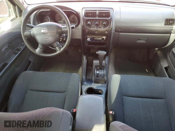 2003 Nissan Frontier XE with VIN 1N6ED27T13C409632, listed as a Copart auction lot 84884434 with 194,167 mi miles and Salvage title. Bid and sale history available at DreamBid. Image 8.