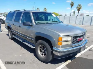 1999 GMC Suburban with VIN 3GKFK16R0XG511301, listed as a IAAI auction lot 41946753 with 231,650 mi miles. Bid and sale history available at carsss.com. Image 1.