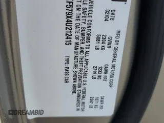 2004 Cadillac DeVille DTS z VIN 1G6KF579X4U212415, wystawiony jako Copart lot #58005555 z przebiegiem 97 663 mil mil oraz Tytuł czysty. Historia ofert i sprzedaży dostępna na DreamBid. Obrazek 12.