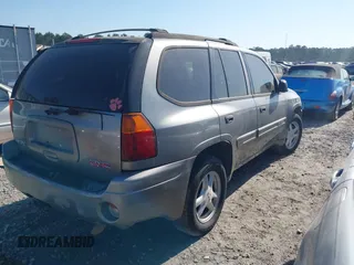 2005 GMC Envoy SLT with VIN 1GKDS13SX52175970, listed as a IAAI auction lot 42047871 with 205,432 mi miles. Bid and sale history available at carsss.com. Image 4.