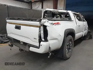 2023 Toyota Tacoma SR with VIN 3TMCZ5ANXPM652495, listed as a IAAI auction lot 42375230 with 26,736 mi miles and . Bid and sale history available at DreamBid. Image 4.