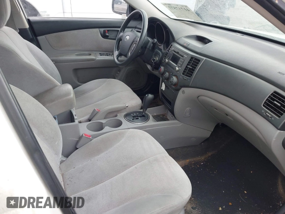 2009 Kia Optima LX z VIN KNAGE228395333286, wystawiony jako IAAI lot #41737577 z przebiegiem 113 152 mil mil oraz . Historia ofert i sprzedaży dostępna na DreamBid. Obrazek 5.