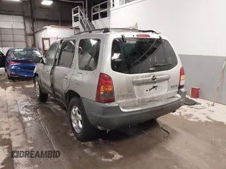 2003 Mazda Tribute DX with VIN 4F2YZ02B73KM43813, listed as a IAAI auction lot 41575708 with 202,214 mi miles and . Bid and sale history available at carsss.com. Image 3.