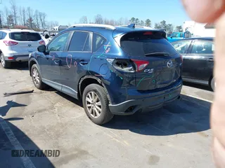2016 Mazda CX-5 Touring with VIN JM3KE4CY0G0631786, listed as a IAAI auction lot 41761214 with 220,058 mi miles. Bid and sale history available at carsss.com. Image 3.