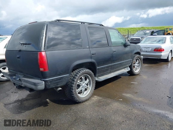 1999 Chevrolet Tahoe Z71 with VIN 1GNEK13R1XJ425996, listed as a IAAI auction lot 41798943 with 203,106 mi miles and . Bid and sale history available at DreamBid. Image 4.