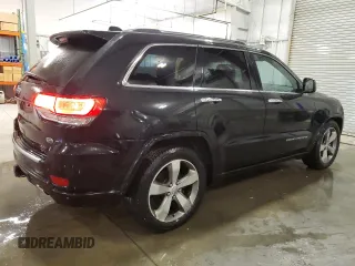 2015 Jeep Grand Cherokee Overland with VIN 1C4RJFCG7FC911899, listed as a Copart auction lot 54123925 with 243,031 mi miles and Salvage Title. Bid and sale history available at carsss.com. Image 3.