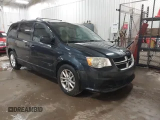 2014 Dodge Grand Caravan SXT with VIN 2C4RDGCGXER154709, listed as a IAAI auction lot 41117603 with 214,872 mi miles and . Bid and sale history available at DreamBid. Image 1.