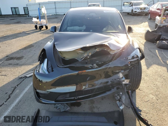 2022 Tesla Model Y Long Range with VIN 7SAYGAEE1NF562042, listed as a Copart auction lot 45702845 with 34,240 mi miles and Salvage Title. Bid and sale history available at carsss.com. Image 5.