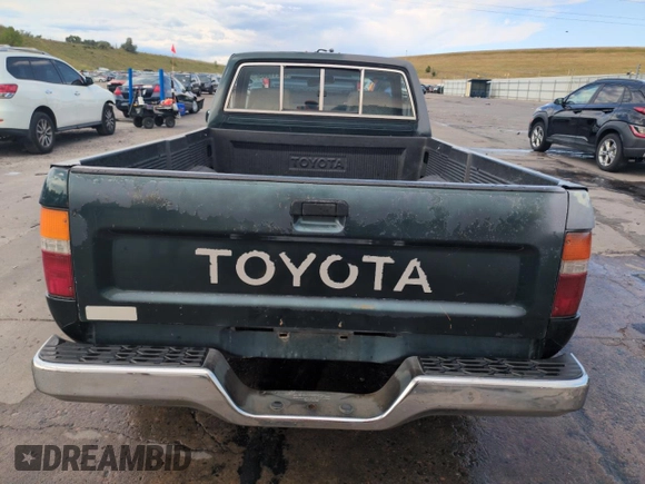 1994 Toyota Pickup DX with VIN JT4RN81PXR5174113, listed as a Copart auction lot 64211905 with 209,694 mi miles and Salvage title. Bid and sale history available at DreamBid. Image 6.