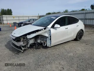 2023 Tesla Model Y Long Range z VIN 7SAYGDEE6PF692970, wystawiony jako Copart lot #56502825 z przebiegiem Nie podano mil oraz Szkoda całkowita • Salvage title. Historia ofert i sprzedaży dostępna na DreamBid. Obrazek 1.