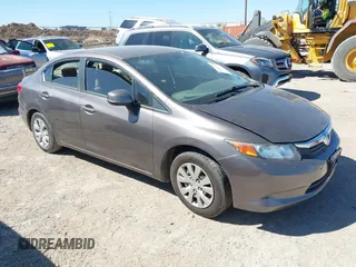 2012 Honda Civic LX z VIN 2HGFB2F55CH524541, wystawiony jako IAAI lot #41869216 z przebiegiem 94 372 mil mil oraz . Historia ofert i sprzedaży dostępna na DreamBid. Obrazek 1.