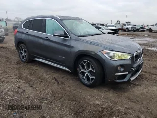 2017 BMW X1 sDrive28i with VIN WBXHU7C3XH5H38074, listed as a Copart auction lot 43088995 with 98,820 mi miles and Salvage Title. Bid and sale history available at carsss.com. Image 4.