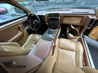 1988 Pontiac Fiero z VIN 1G2PE119XJP213392, wystawiony jako Copart lot #76264064 z przebiegiem 71 246 mil mil oraz Tytuł czysty. Historia ofert i sprzedaży dostępna na DreamBid. Obrazek 9.