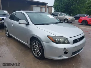 2008 Scion tC Spec with VIN JTKDE167580236127, listed as a IAAI auction lot 41962153 with 218,676 mi miles. Bid and sale history available at carsss.com. Image 1.